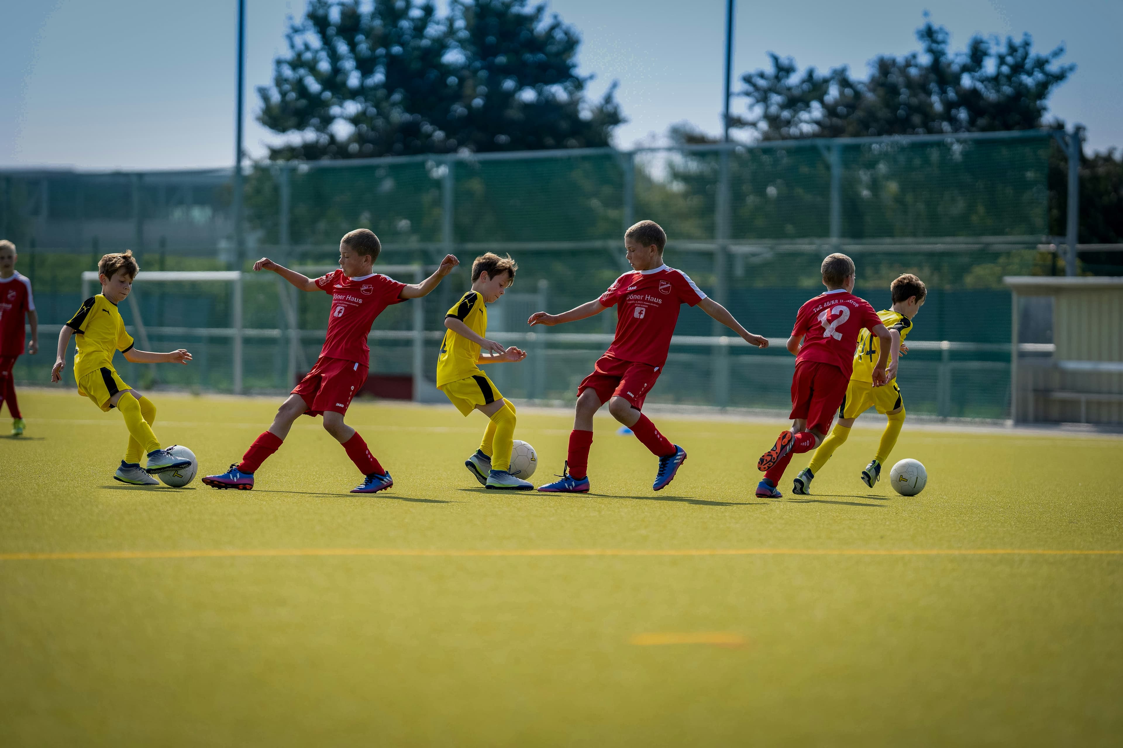 Community sports facility in Scotland with people taking part in outdoor physical activity
