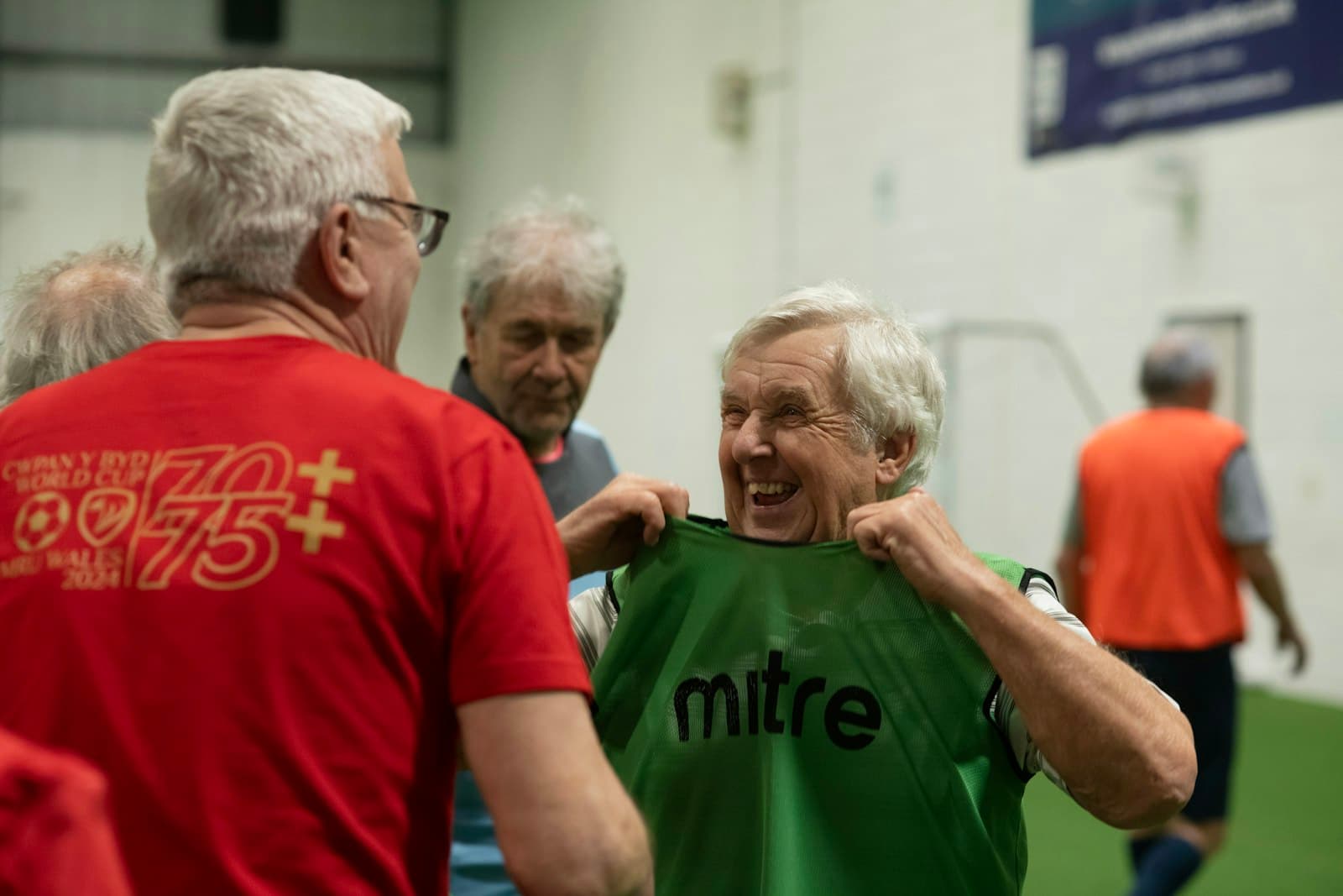 Older men laughing together at a community walking football session, representing the kind of local organisation the Garfield Weston Foundation funds