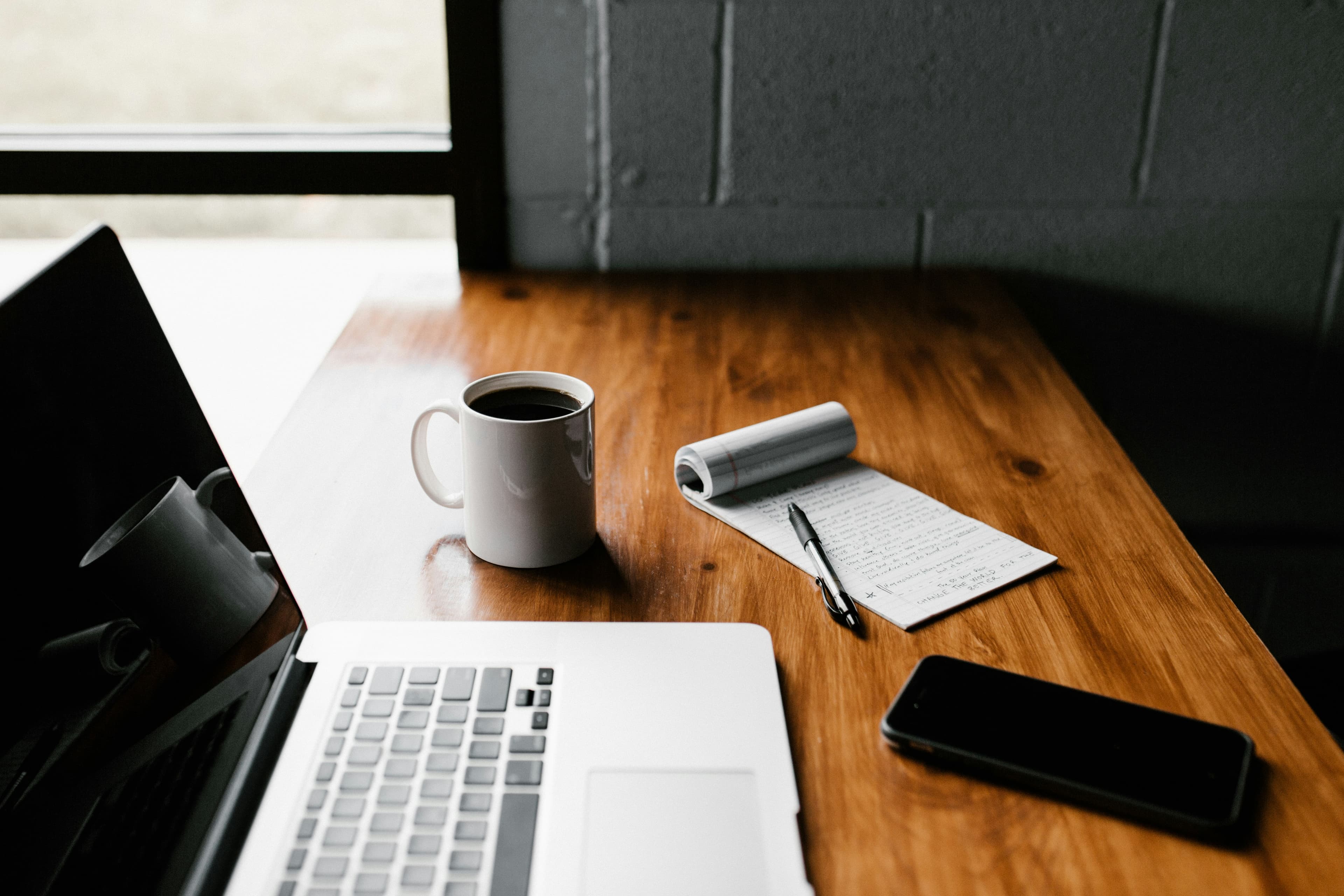 Person working at laptop writing a UK grant application